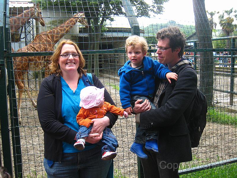 IMG_7221.JPG - Our little family, back with the giraffes. Our trip is over, time to head home.