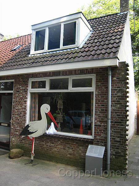IMG_5551.JPG - Worker's housing - the stork outside the window advertises a new arrival.