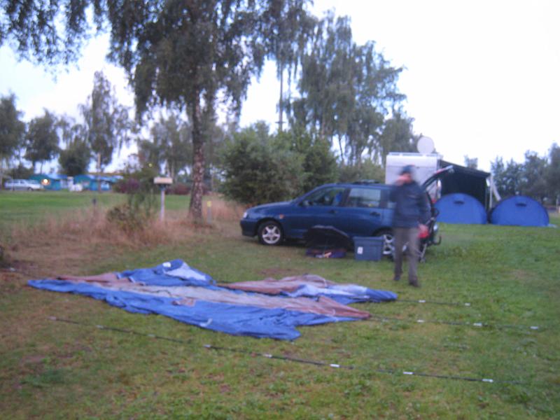 IMG_3100.JPG - Setting up a wet tent in the rain. There was a bit of swearing involved.